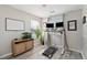Bright home office with a stand up desk, treadmill, and natural light at 8816 Kellum Dr, North Charleston, SC 29420
