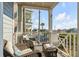 Relaxing balcony seating with view of palm trees and neighborhood at 9 J C Long Blvd, Isle of Palms, SC 29451