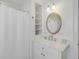 Clean bathroom with a sink, mirror, and a shower curtain at 9 J C Long Blvd, Isle of Palms, SC 29451