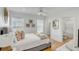 Charming bedroom with natural light, an ensuite bathroom, and beautiful wood floors at 9 J C Long Blvd, Isle of Palms, SC 29451
