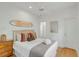 Bright bedroom featuring a surfboard decoration, neutral decor, and ceiling fan at 9 J C Long Blvd, Isle of Palms, SC 29451