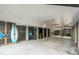 Spacious garage with ample room for storage and recreational equipment, surfboard, and beach chairs at 9 J C Long Blvd, Isle of Palms, SC 29451