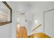 Bright hallway with hardwood floors leads to bedrooms and features a mirror and stairway at 9 J C Long Blvd, Isle of Palms, SC 29451