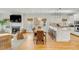 A large living area that combines seating and dining areas with a modern kitchen, seamlessly connecting each space at 9 J C Long Blvd, Isle of Palms, SC 29451