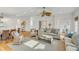 Spacious living room featuring hardwood floors, ceiling fan, and plush seating arrangements at 9 J C Long Blvd, Isle of Palms, SC 29451