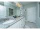 Granite countertop with double sinks and a decorative mirror in this bathroom at 103 Noisette Row, Summerville, SC 29483