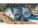 Attractive exterior elevation of a well-designed home featuring a two-car garage and manicured landscaping at 103 Noisette Row, Summerville, SC 29483