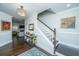 Inviting foyer with hardwood floors, a staircase and access to the living area at 103 Noisette Row, Summerville, SC 29483