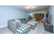Comfortable living room with a gray sectional, blue accents and a bookshelf at 103 Noisette Row, Summerville, SC 29483