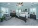 Serene main bedroom featuring a tray ceiling, plantation shutters and stylish furnishings at 103 Noisette Row, Summerville, SC 29483