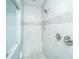 A well-lit shower featuring a tiled bench and shower niche at 103 Noisette Row, Summerville, SC 29483