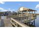 Covered dock with seating offering scenic views of the water and boat storage at 1042 Chambers Ln, Mount Pleasant, SC 29464