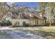 Charming traditional home with mature trees, offering a front porch, established landscaping, and a inviting curb appeal at 1042 Chambers Ln, Mount Pleasant, SC 29464