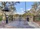 Secured gated entrance to property with mature trees at 1042 Chambers Ln, Mount Pleasant, SC 29464