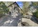Detached two-car garage with a large driveway, providing ample parking and storage space and mature landscaping at 1042 Chambers Ln, Mount Pleasant, SC 29464
