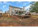 Exterior of home with wooden deck and partially fenced yard at 105 Carter Dr, Goose Creek, SC 29445