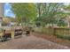 Charming wooden deck surrounded by lush trees and a fenced yard at 105 Carter Dr, Goose Creek, SC 29445
