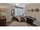 Cozy bedroom featuring a piano, hats displayed on wall, and warm lighting at 105 Carter Dr, Goose Creek, SC 29445