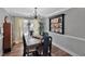 Elegant dining room featuring stylish lighting, gray walls, wood floors, and a large table with seating for six at 105 Carter Dr, Goose Creek, SC 29445
