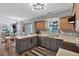 Bright and airy kitchen featuring gray and wood cabinets, stainless steel appliances, and an eat-in dining area at 105 Carter Dr, Goose Creek, SC 29445