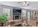 Bright living room featuring a fireplace, TV, and seamless flow to the dining area, perfect for modern living at 105 Carter Dr, Goose Creek, SC 29445