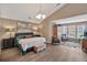 Spacious bedroom featuring a comfortable bed, stylish furnishings, and ample natural light for a serene retreat at 105 Carter Dr, Goose Creek, SC 29445