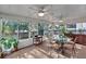 Bright sunroom with a glass table and chairs providing the perfect spot for indoor/outdoor relaxation and entertaining at 105 Carter Dr, Goose Creek, SC 29445