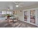 Cozy sunroom featuring a glass table and chairs with the doors opened to the outdoor deck at 105 Carter Dr, Goose Creek, SC 29445
