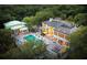 Aerial view of a home's outdoor pool and a covered outdoor lounge area surrounded by lush trees at 1105 Fort Lamar Rd, James Island, SC 29412