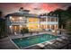 A backyard featuring a pool and a deck with outdoor seating, perfect for entertaining and relaxing at 1105 Fort Lamar Rd, James Island, SC 29412