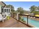 Relaxing backyard featuring a pool, wood deck, and marsh views from the manicured property at 1105 Fort Lamar Rd, James Island, SC 29412