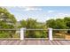 Wooden deck with view of marsh and waterway beyond a metal railing at 1105 Fort Lamar Rd, James Island, SC 29412
