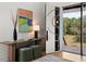 Bright foyer with modern console table, decor, and a glimpse of outdoor scenery through the glass door at 1105 Fort Lamar Rd, James Island, SC 29412