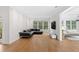 Minimalist living room with contemporary decor, featuring hardwood floors and abundant natural light at 1105 Fort Lamar Rd, James Island, SC 29412