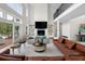 Bright living room with soaring ceilings, fireplace, open floor plan, and easy access to the deck at 1105 Fort Lamar Rd, James Island, SC 29412