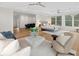 Spacious living room featuring plush seating, hardwood floors, and an adjacent bedroom at 1105 Fort Lamar Rd, James Island, SC 29412