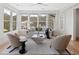 Bright living room with a ceiling fan, lots of natural light, and comfortable seating at 1105 Fort Lamar Rd, James Island, SC 29412