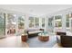 Cozy living room with stylish furniture, opening onto a deck with a pool view at 1105 Fort Lamar Rd, James Island, SC 29412