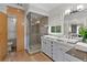 Elegant main bathroom with a glass shower, double sinks, and stylish fixtures at 1105 Fort Lamar Rd, James Island, SC 29412