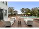 Outdoor pool deck with cozy seating and lounge chairs, great for relaxation and entertainment at 1105 Fort Lamar Rd, James Island, SC 29412