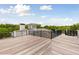 Wide rooftop deck with metal railings offering panoramic view of surrounding greenery at 1105 Fort Lamar Rd, James Island, SC 29412