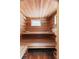 Inviting cedar sauna featuring built-in benches and a window for natural light and ventilation at 1105 Fort Lamar Rd, James Island, SC 29412