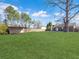 Large grassy backyard with shed, privacy fence and mature trees at 115 O'Carroll St, Moncks Corner, SC 29461