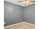 Bedroom featuring modern gray walls, ceiling fan, and natural light at 115 O'Carroll St, Moncks Corner, SC 29461