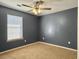 Bedroom featuring modern gray walls, ceiling fan, and natural light at 115 O'Carroll St, Moncks Corner, SC 29461