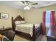 Bedroom with warm carpet, ceiling fan, and a large wooden bed at 115 O'Carroll St, Moncks Corner, SC 29461