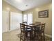 Cozy dining area with a square table, seating for four, and sliding door access to the outside at 115 O'Carroll St, Moncks Corner, SC 29461