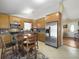 Spacious kitchen with wood cabinets, stainless steel appliances, and dining area at 115 O'Carroll St, Moncks Corner, SC 29461