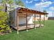 Outdoor shed featuring a covered wooden deck, ideal for storage and outdoor activities at 115 O'Carroll St, Moncks Corner, SC 29461