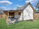 Outdoor storage shed with covered deck, perfect for storage, with green grass all around at 115 O'Carroll St, Moncks Corner, SC 29461
